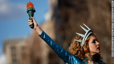 NEW YORK, NY - MARCH 8: Dressed as the Statue of Liberty, Sonia Sheron performs onstage during a rally to mark International Women&#39;s Day in Washington Square Park, March 8, 2017 in New York City. Thousands of women marked International Women&#39;s Day with a marches and rallies around the globe to support women&#39;s issues. (Photo by Drew Angerer/Getty Images)