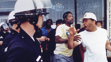 An argument between police and civilians preceding a rock- and brick-throwing incident at the corner of Vermont and 1st Street on April 29, 1992 in Los Angeles, California.