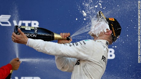 Race winner Valtteri Bottas celebrates on the podium of the Russian Grand Prix.