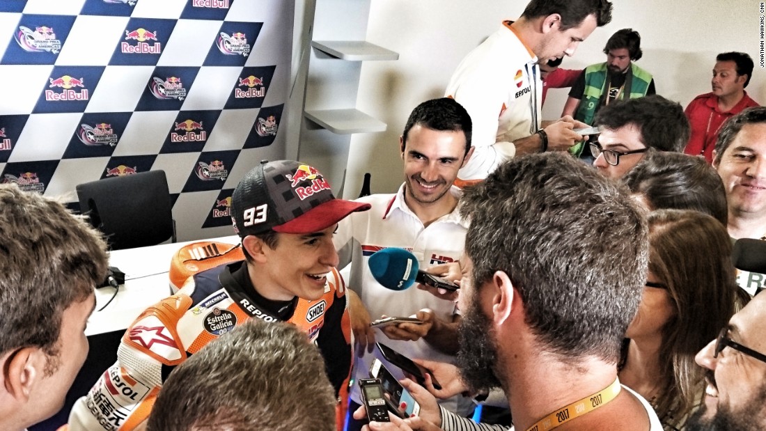 Marc Marquez celebrates his race win with reporters in Austin, his fifth consecutive win at the circuit.