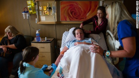 Jessica is surrounded by friends, family and hospital staff shortly before her C-section on April 20. 