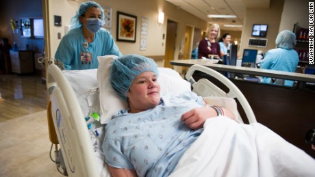 Nurse Kirby Ginn wheels Jessica toward the operating room. 