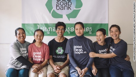 CNN Hero Samir Lakhani, wearing glasses, poses with staff at the Eco-Soap Bank--an organization he founded to provide soap and hygiene education to Cambodians in need.