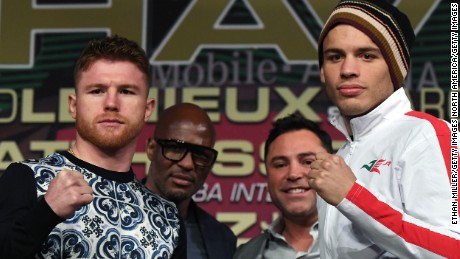 LAS VEGAS, NV - MAY 03:  Boxers Canelo Alvarez (L) and Julio Cesar Chavez Jr. (R) pose during a news conference as Golden Boy Promotions partner Bernard Hopkins (2nd L) and Golden Boy Promotions Chairman and CEO Oscar De La Hoya (2nd R) look on at the KA Theatre at MGM Grand Hotel & Casino on May 3, 2017 in Las Vegas, Nevada. Alvarez and Chavez Jr. will meet in a 164.5-pound catch weight bout on May 6 at T-Mobile Arena in Las Vegas.  (Photo by Ethan Miller/Getty Images)