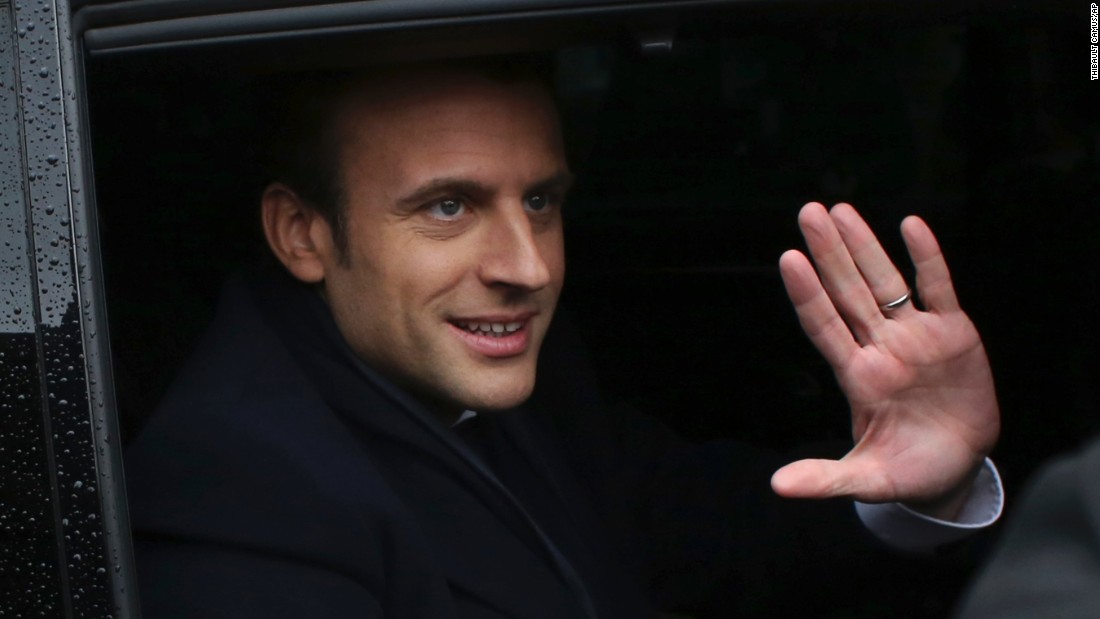 Macron waves as he leaves a polling station after casting his ballot in Le Touquet, France, on May 7.