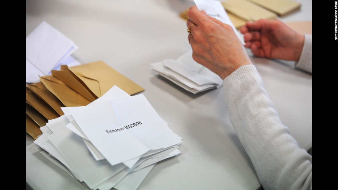 A polling official counts ballots on May 7 in Quimper, France.