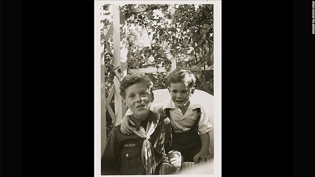 Kennedy wears his Cub Scout uniform as he poses with his brother, Tim, circa 1946.