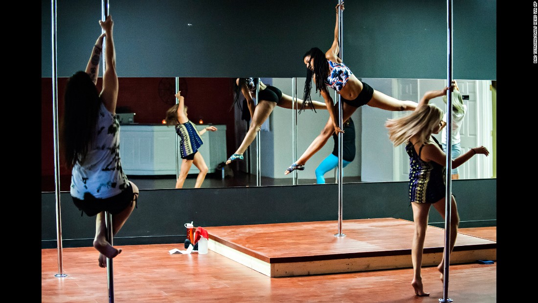 Atiya Hodges, center, teaches a pole dancing class at Taboo Dance &amp;amp; Fitness in Bowling Green, Kentucky. Experts say the class is a demanding one that requires skill and technique, which in turn uses energy.