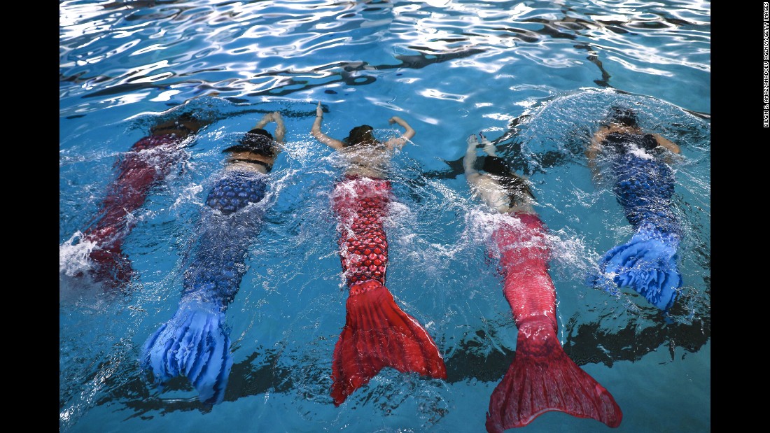Women practice swimming with mermaid tails at AquaMermaid swimming school in Chicago. Fitness experts believe any class engaging people in long-lost passions or curiosities will benefit the health of a population.