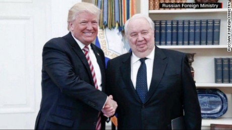 White House furious after photos released with Russians