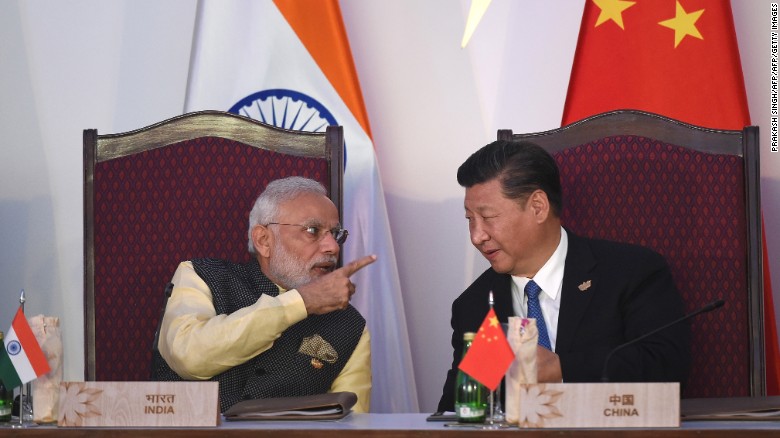 India Prime Minister Narendra Modi gestures while talking with China&#39;s President Xi Jinping in Goa on October 16, 2016.