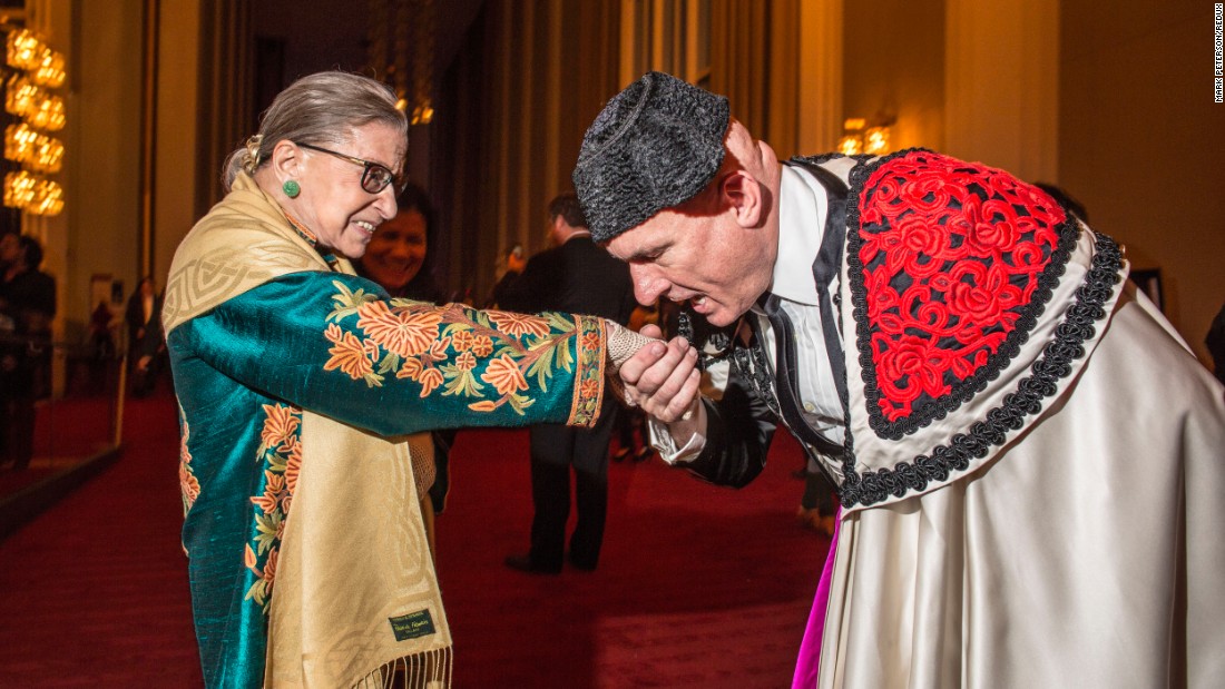 Ginsburg, with an extra from &quot;Carmen,&quot; attends the opera at the Kennedy Center in Washington in October 2015.
