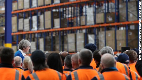 British Prime Minister Theresa May speaks to workers at a distribution center in Stoke-on-Trent.