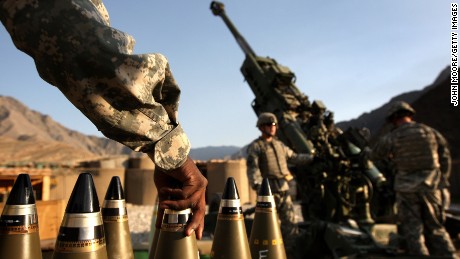 CAMP BLESSING, AFGHANISTAN - OCTOBER 22:  Artilerymen await coordinates before firing a 155mm Howlitzer on a Taliban position October 22, 2008 from Camp Blessing in the Kunar Province of eastern Afghanistan. Their unit, Charlie Battery, 3rd Battalion of the 321 Field Artilery, has fired more than 5,900 shells since it deployed to Afghanistan less than a year ago, making it the busiest artilery unit in the U.S. Army, according to to military officers. They most often fire in support of Army infantry units battling Taliban insurgents in the nearby Korengal Valley, site of some of the heaviest fighting in Afghanistan.  (Photo by John Moore/Getty Images)