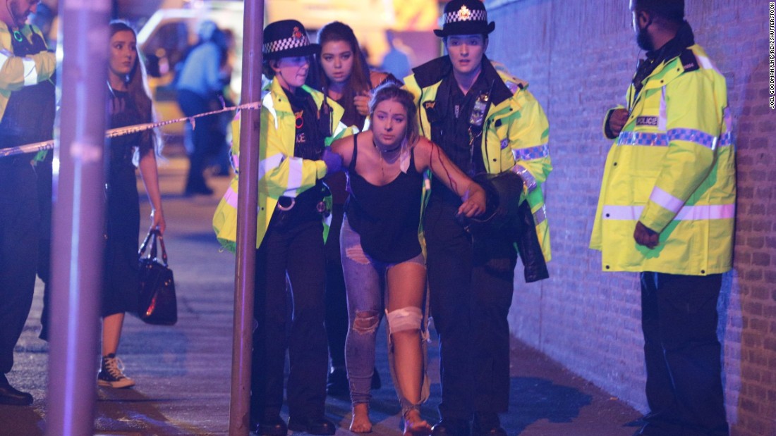 Police help someone after the attack at Manchester Arena on Monday, May 22.