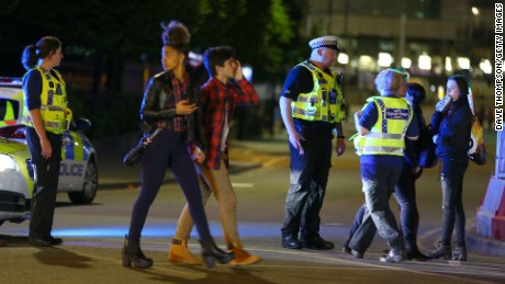 MANCHESTER, ENGLAND - Police and fans close to the Manchester Arena on May 23, 2017 in Manchester, England.  There have been reports of explosions at Manchester Arena where Ariana Grande had performed this evening.  Greater Manchester Police have have confirmed there are fatalities and warned people to stay away from the area. (Photo by Dave Thompson/Getty Images)