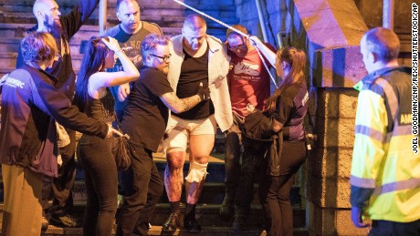 Police help victims of the attack on Monday night. 