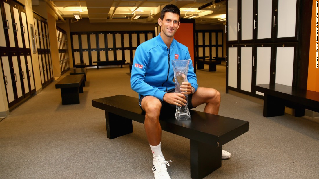 As well as a place of preparation for matches, locker rooms are also a perfect setting for posing for photos after winning trophies. Novak Djokovic is pictured holding the Butch Bucholz trophy after winning his fifth Miami Open title in 2015.