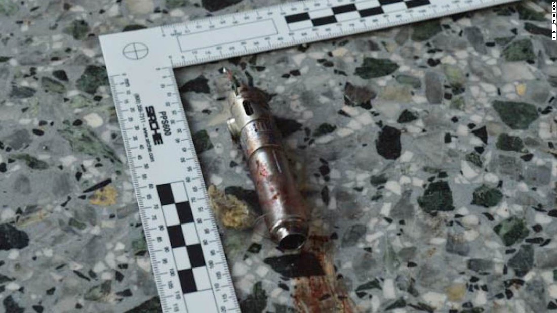 A ruler shows the length of a possible detonator that was reported to have been found in the suspect&#39;s left hand.