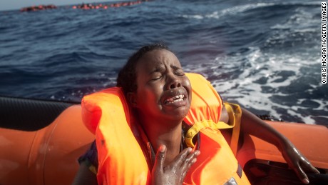  A woman cries after losing her baby as she sits in a rescue boat on May 24, 2017 off Lampedusa, Italy. 