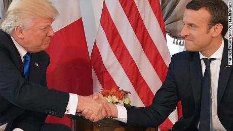 US President Donald Trump (L) and French President Emmanuel Macron (R) shake hands ahead of a working lunch, at the US ambassador&#39;s residence, on the sidelines of the NATO (North Atlantic Treaty Organization) summit, in Brussels, on May 25, 2017. / AFP PHOTO / Mandel NGAN        (Photo credit should read MANDEL NGAN/AFP/Getty Images)