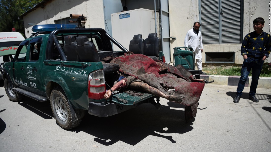 Victims&#39; bodies are placed in the back of a police truck at a hospital in Kabul.