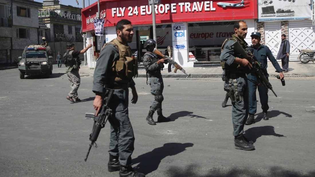 Security forces gather near the site of the attack. 