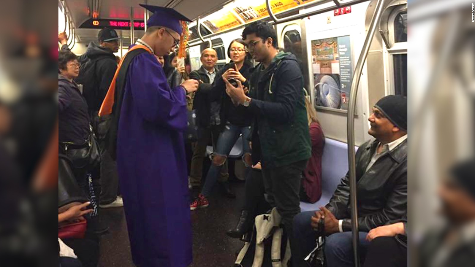 Student 'graduates' on the subway - CNN Video