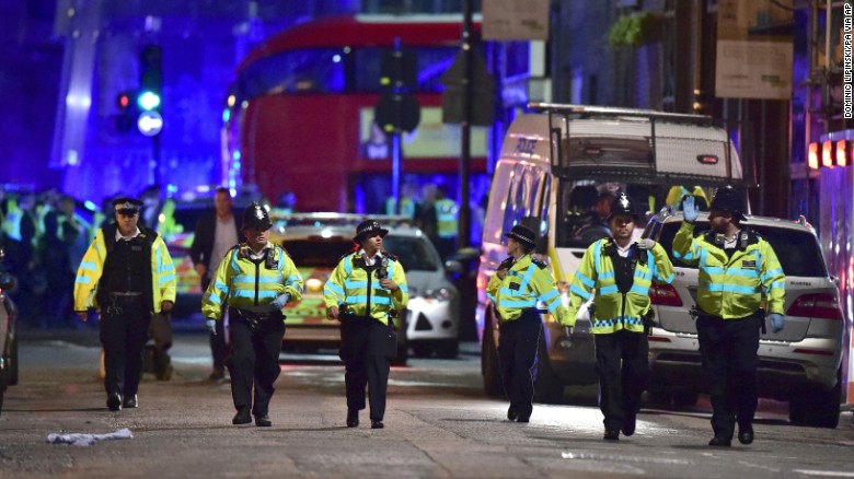 Police officers on Borough High Street as police are dealing with an incident on London Bridge in London, Saturday, June 3, 2017.    Witnesses reported a vehicle hitting pedestrians and injured people on the ground. (Dominic Lipinski/PA via AP)