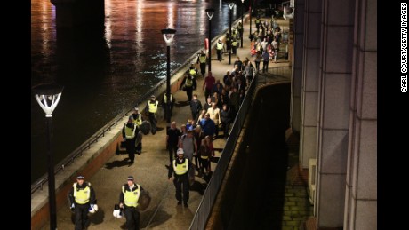 People are lead to safety away from London Bridge.