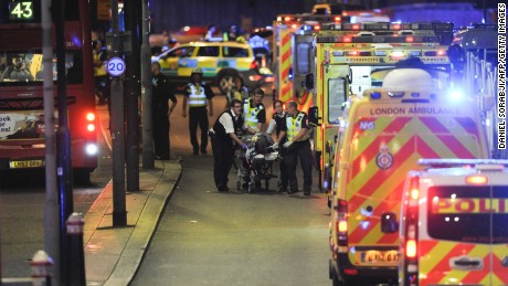 Police officers and members of the emergency services attend to a person injured in the June 3 attack on London Bridge.