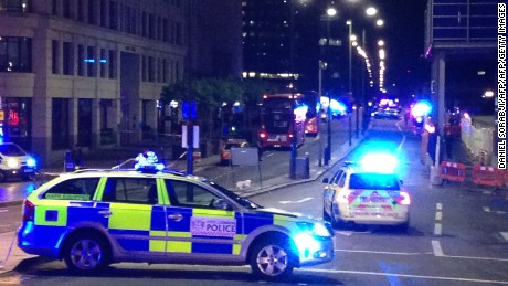 TOPSHOT - A photograph taken on a mobile phone shows British police cars blocking the entrance to London Bridge, in central London on June 3, 2017, following an incident on the bridge. 
Police are dealing with a &quot;major incident&quot; on London Bridge, Transport for London said on Saturday, after witnesses reported seeing a van mounting the pavement and hitting pedestrians. / AFP PHOTO / Daniel SORABJI        (Photo credit should read DANIEL SORABJI/AFP/Getty Images)