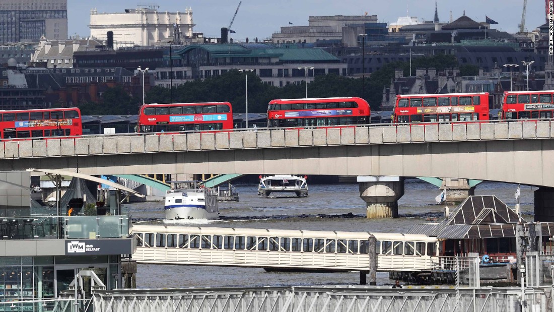 Abandoned buses line London Bridge as the scene remains under investigation following the attack. Metropolitan Police Assistant Commissioner Mark Rowley said in a statement Sunday that a white van struck pedestrians on London Bridge.  Attackers then left the vehicle and &quot;a number of people were stabbed, including an on-duty British Transport Police officer who was responding to the incident at London Bridge,&quot; said Rowley. The officer received serious but not life-threatening injuries.