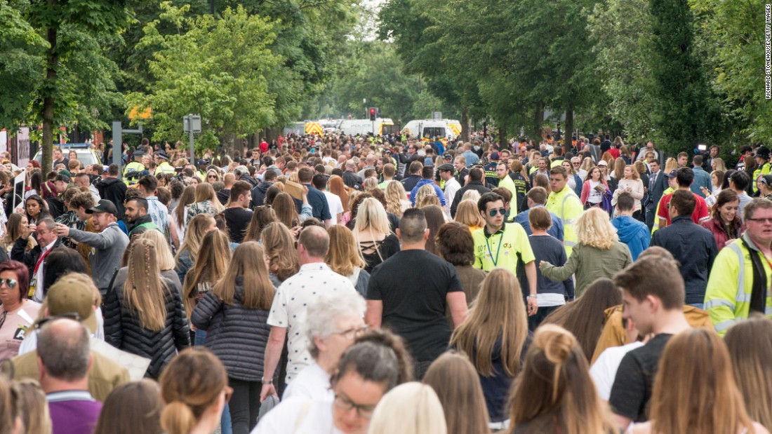 Members of the public arrive before the concert. 