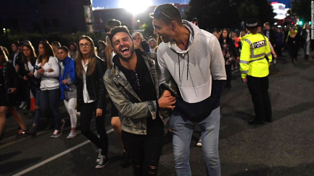 People leave the stadium after the concert. 