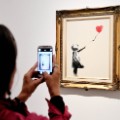 01 Banksy girl with balloon FILE
