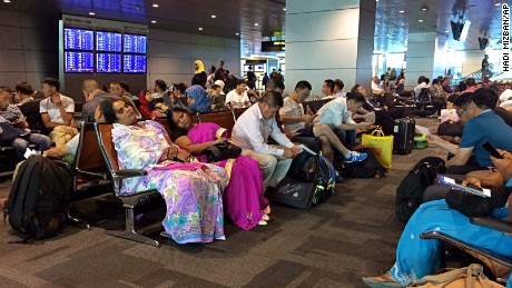 Passengers of cancelled flights wait on Tuesday, June 6, in Hamad International Airport in Doha, Qatar.