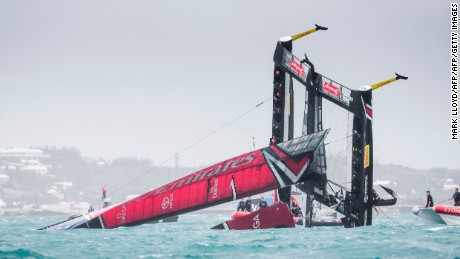 TOPSHOT - Emirates Team New Zealand skippered by Peter Burling is seen capsizing at the race start in race 5 of the 35th America&#39;s Cup Challenger Playoffs Semi-finals on June 6, 2017 in Bermuda&#39;s Great Sound. / AFP PHOTO / Mark Lloyd        (Photo credit should read MARK LLOYD/AFP/Getty Images)