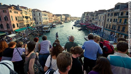 LONDON, ENGLAND - SEPTEMBER 09:  Tourists look at the view across the Grand Canal from the Rialto bridge on September 9, 2011 in Venice, Italy. (Photo by Ian Gavan/Getty Images)