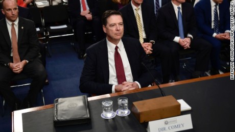 Former FBI Director James Comey arrives to testify during a US Senate Select Committee on Intelligence hearing on Capitol Hill in Washington,DC, June 8, 2017. / AFP PHOTO / Brendan Smialowski        (Photo credit should read BRENDAN SMIALOWSKI/AFP/Getty Images)