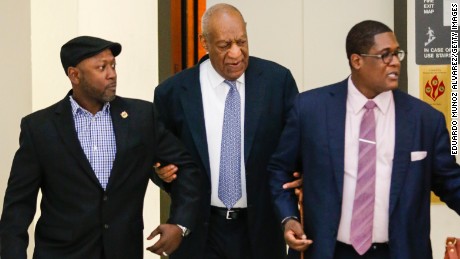 Actor Bill Cosby and aide Andrew Wyatt arrive in 2017 for Cosby&#39;s trial on sexual assault charges in Pennsylvania.  