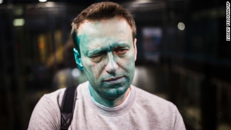 In this April 27, 2017 photo, Russian opposition leader Alexei Navalny is seen after unknown attackers doused him with green antiseptic outside a conference venue in Moscow, Russia. Russian opposition leader Alexei Navalny wrote on Instagram on Tuesday May 9, 2017 that he has undergone eye surgery in Spain and that doctors expect the vision in his right eye to be restored in several months, after being attacked.