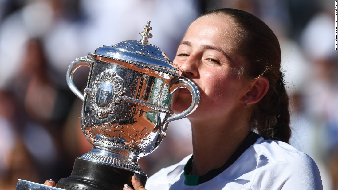 Jelena Ostapenko savors the Suzanne Lenglen trophy after winning the &lt;a href=&quot;http://www.cnn.com/2017/06/10/tennis/french-open-women-final-halep-ostapenko/index.html&quot;&gt;women&#39;s French Open&lt;/a&gt; against Simona Halep in three sets 4-6, 6-4, 6-3 at Roland Garros stadium on June 10, in Paris.