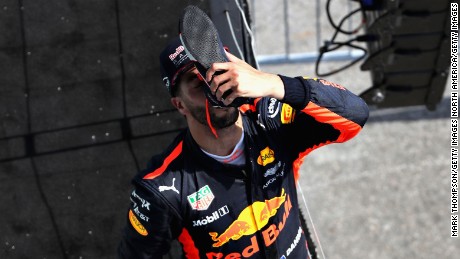 Daniel Ricciardo reprises his &quot;shoey&quot; celebration on the podium in Montreal.