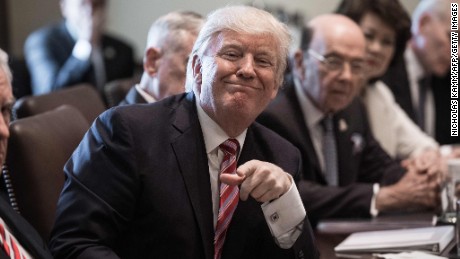 President Donald Trump smiles during a cabinet meeting at the White House in Washington, DC, on June 12, 2017.