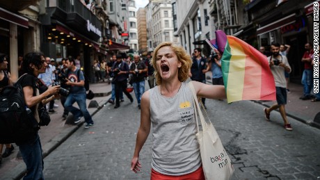 A protester waves a rainbow flag during a rally staged by the LGBT community in Istanbul in 2016.