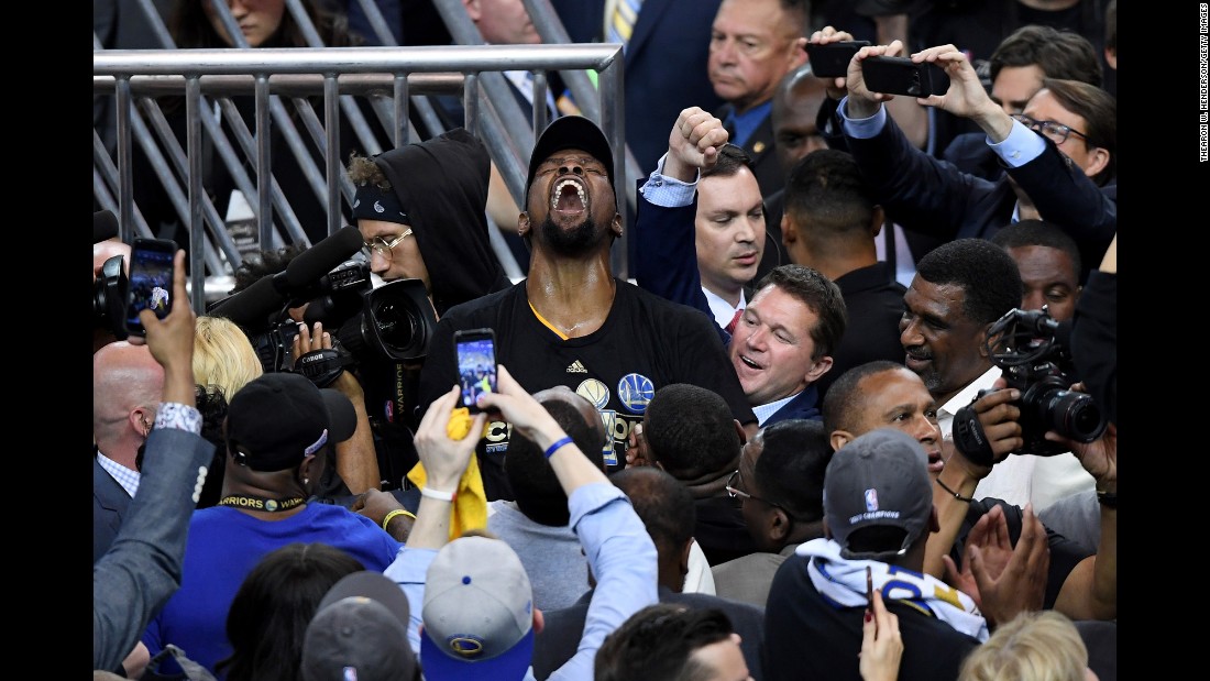 Durant is mobbed by photographers after the final buzzer.
