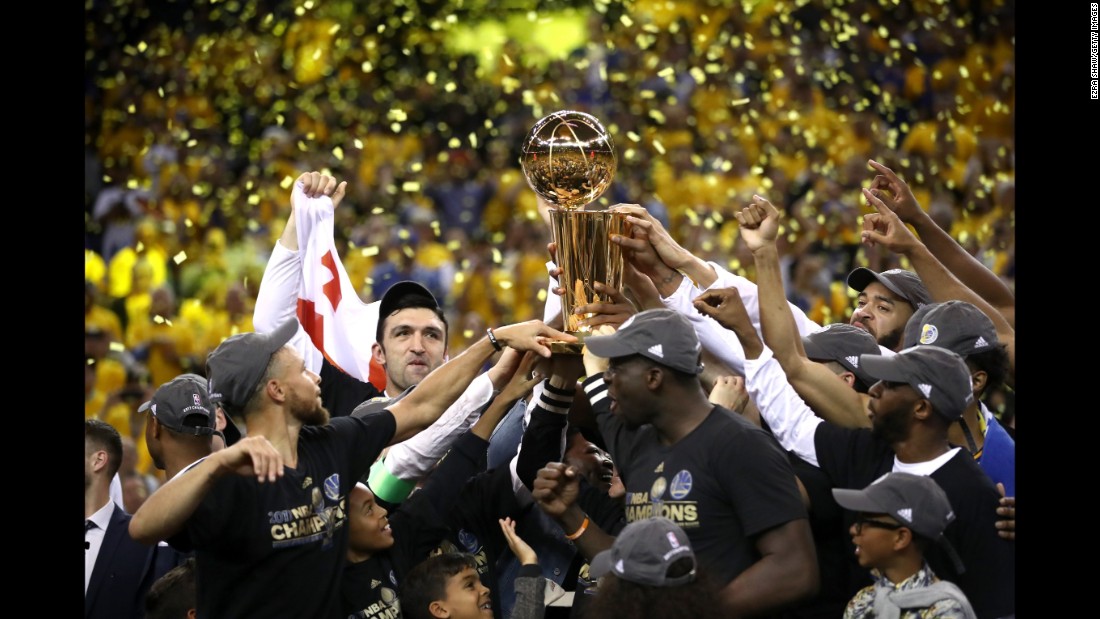 The Golden State Warriors celebrate with the Larry O&#39;Brien Championship Trophy after winning Game 5 of the NBA Finals on Monday, June 12. Golden State won 129-120 to collect its second title in three years.