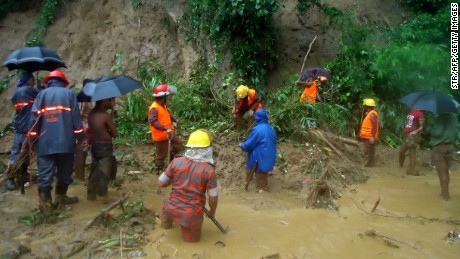 Firefighters search for bodies in Bandarban. Authorities fear the death toll will rise. 