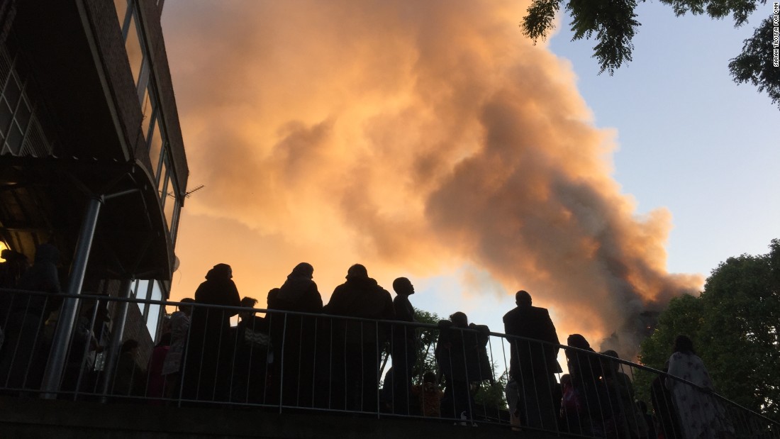 Residents of nearby Whitchurch Road watch smoke streaming from the tower.